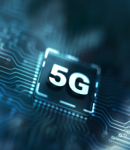 A close-up of a circuit board showing a microchip labeled '5G' surrounded by intricate blue circuitry traces.
