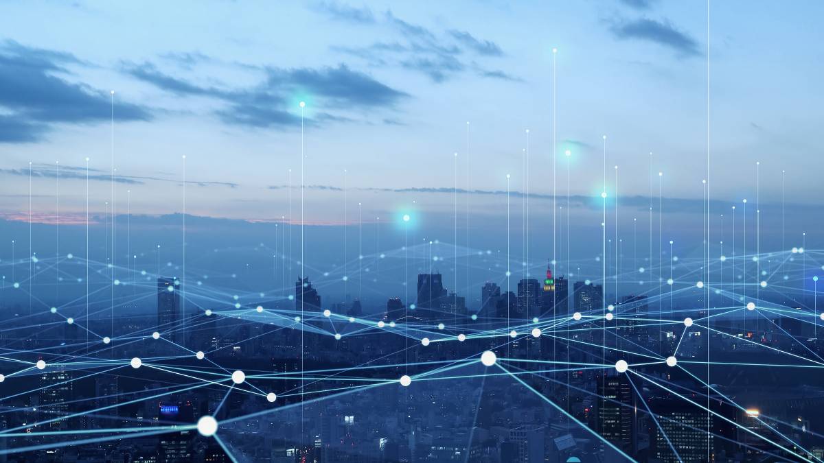 An illustration of a connected network overlaying a city.