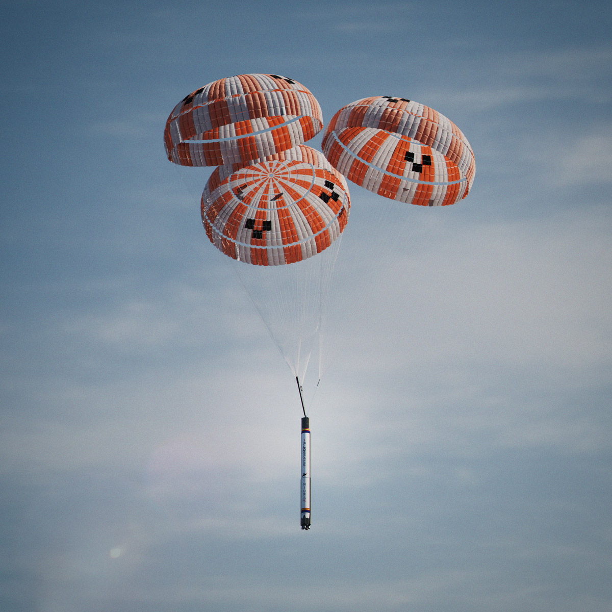MIURA 5 rocket first stage descending under three-balloon parachute system during recovery test drop from Boeing helicopter, showcasing reusable launch vehicle technology against clear blue sky.