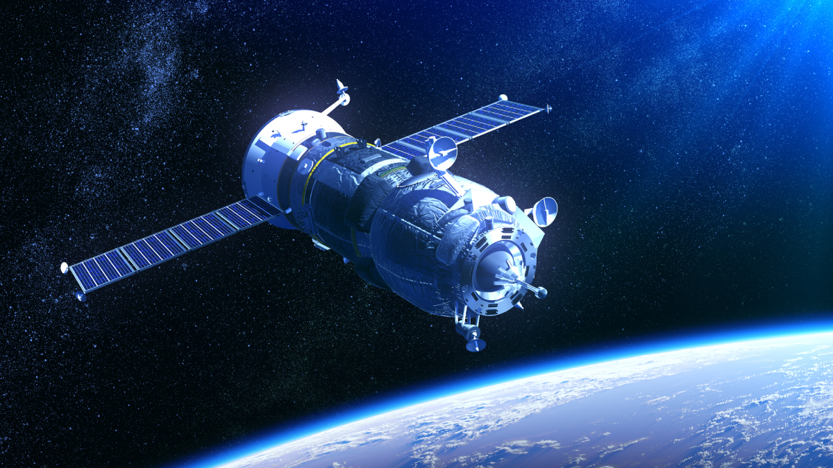 A satellite with extended solar panels orbits above the Earth's atmosphere against a starry background.
