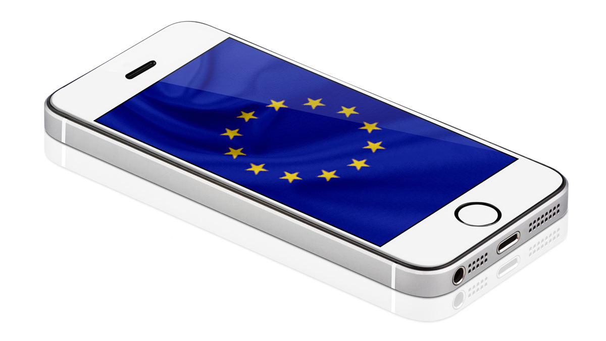 A white smartphone displays the European Union flag on its screen, symbolizing EU digital connectivity and regulation.