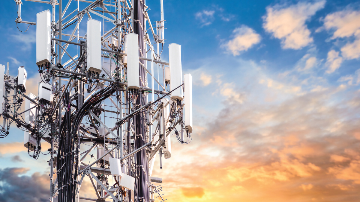 5G cellular tower with multiple antennas at sunset, symbolizing private 5G infrastructure and the role of space technology in boosting network performance and connectivity.