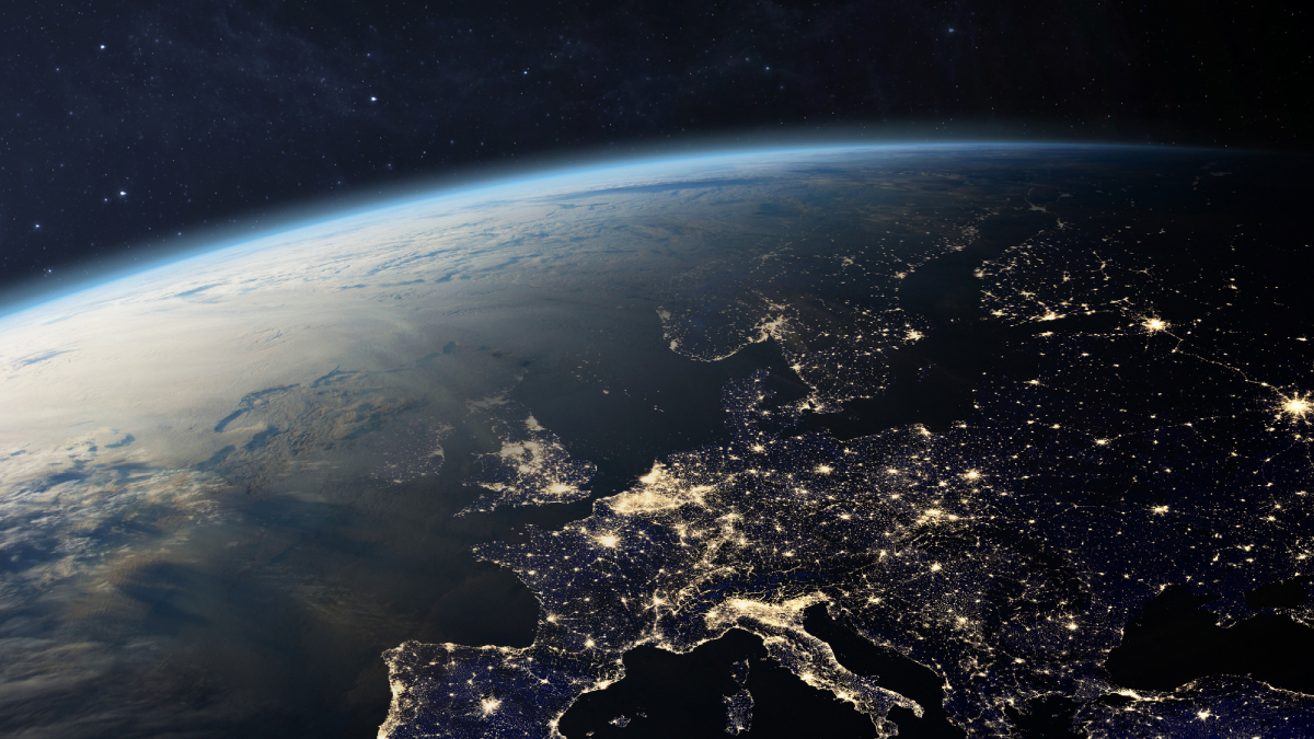 Europe's illuminated cities viewed from space at night, highlighting the continent's interconnected infrastructure.