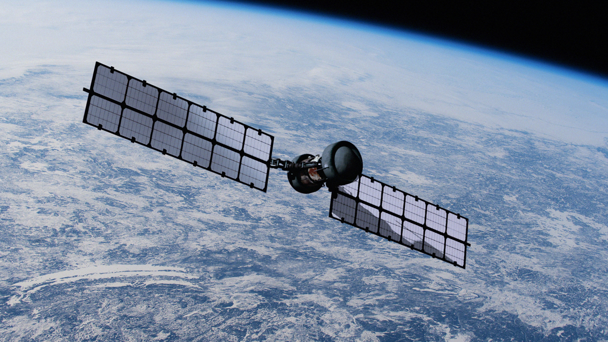 An operational satellite with large, extended solar panels orbits Earth against the backdrop of the planet's blue surface and atmosphere.