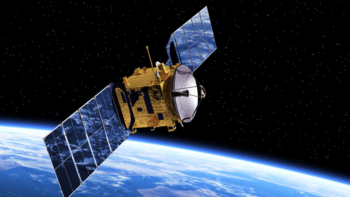Gold-colored satellite with blue solar panels extended, orbiting high above the curved blue horizon of Earth against a starry black background.