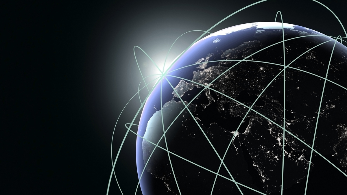 Digital illustration of Earth at night with glowing green orbital lines representing a global network of satellite connectivity.