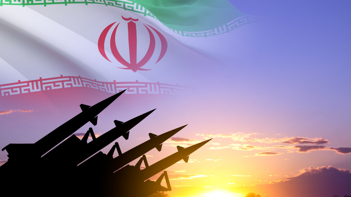 Silhouettes of four missiles against a sunset sky with the flag of Iran subtly overlaid in the background.