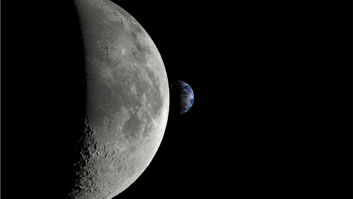 An illuminated crescent Moon dominates the left side of the frame as the blue and white planet Earth peeks out from behind its curved horizon against the black vacuum of space.