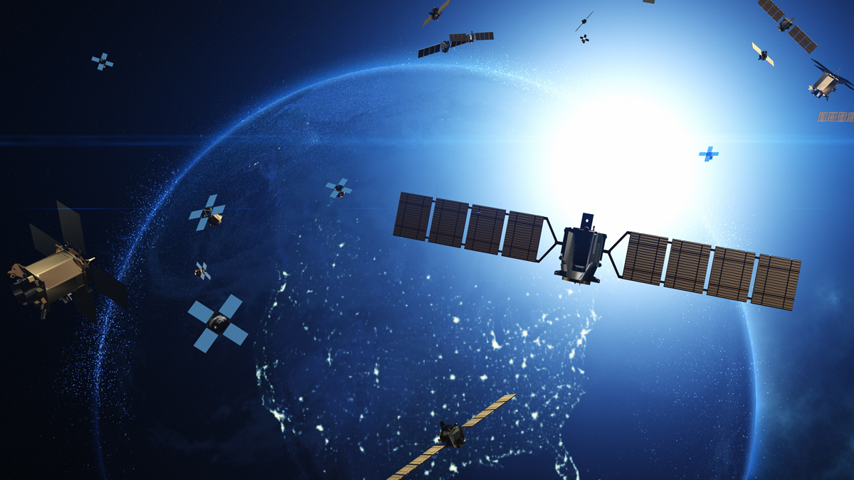 A digital illustration of various satellites and pieces of spacecraft orbiting Earth, highlighting the crowded environment of objects in low Earth orbit.