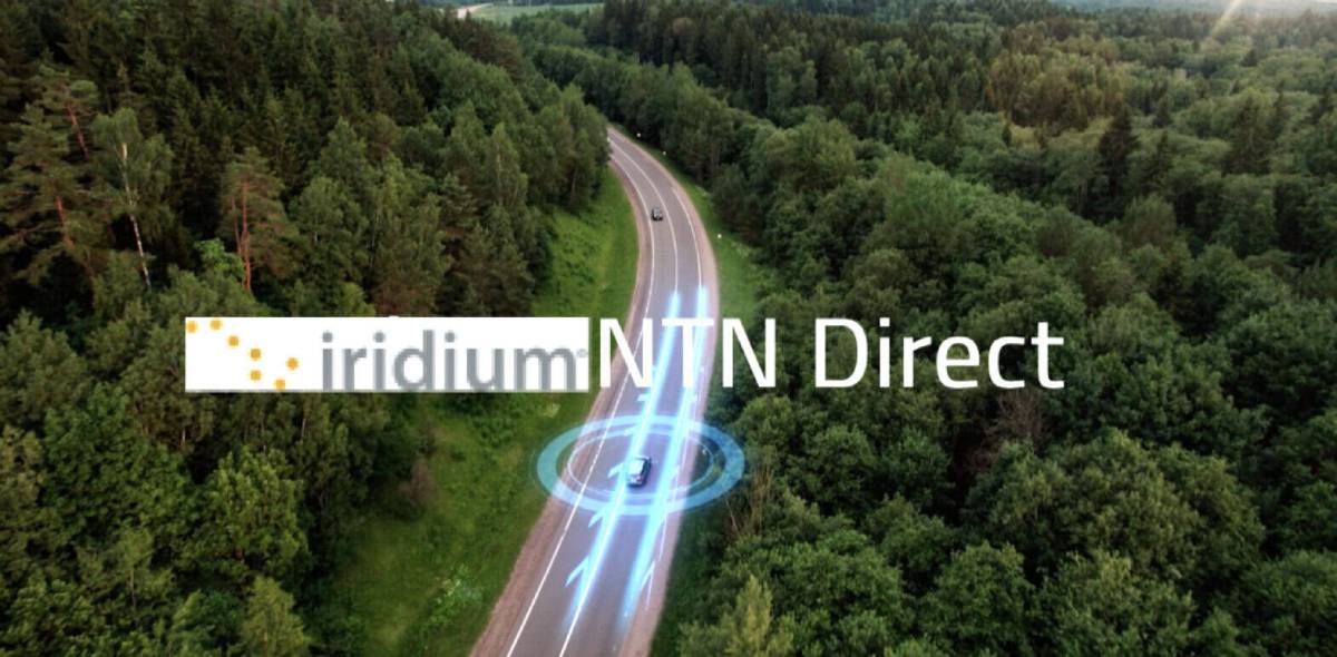 An aerial view of a car driving along a forested road, featuring the text 'iridium NTN Direct' alongside glowing blue signal graphics connecting to the vehicle.