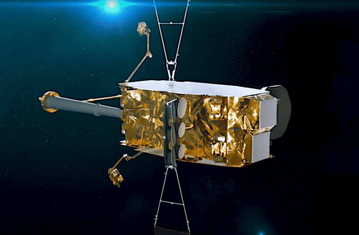 An artist's rendering depicts the boxy, gold-foil-wrapped SpainSat NG satellite floating in orbit with its antennas and solar panel structures deployed against a dark, starry background.