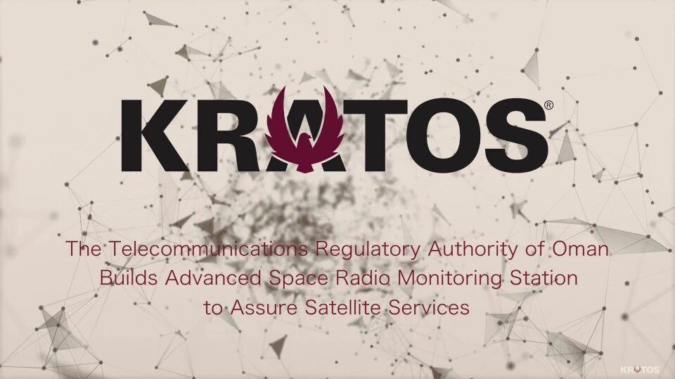 Video title slide featuring the Kratos corporate logo over a beige geometric particle web background, announcing Telecommunications Regulatory Authority of Oman space radio monitoring station.