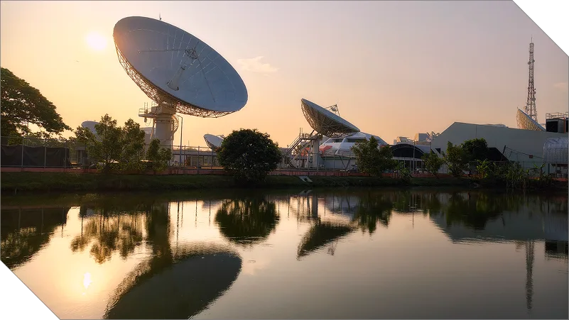 Satellite dishes at sunset earth station