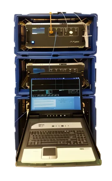 Ruggedized portable communications rack system housed in blue protective transit cases with an integrated fold-out laptop terminal display.