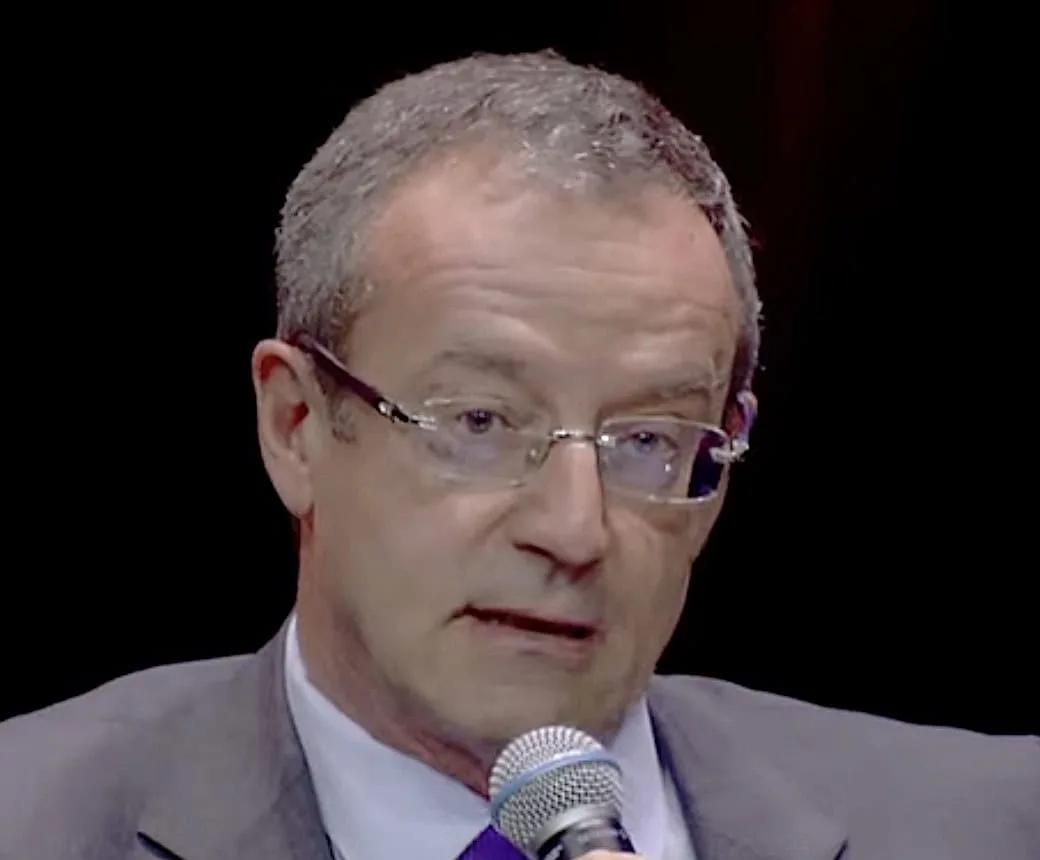 Eutelsat Chief Executive Jean-François Fallacher speaking into a microphone during a conference.
