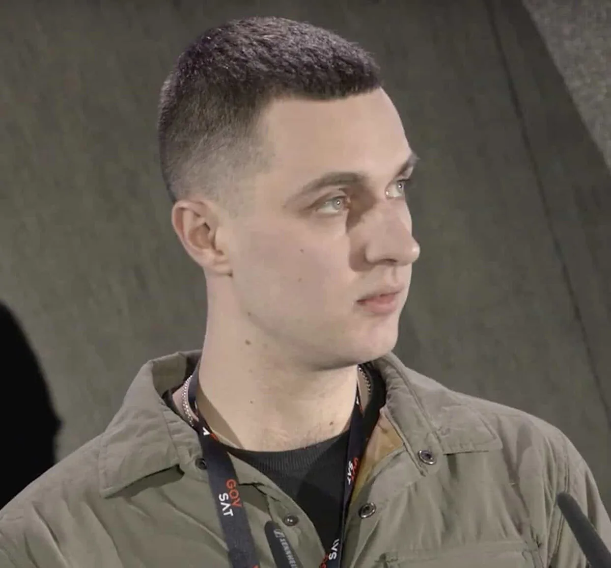 Headshot of Lt. Col. Serhiy Koziy Olehhovych wearing a green jacket and GovSat lanyard, looking slightly to his right.