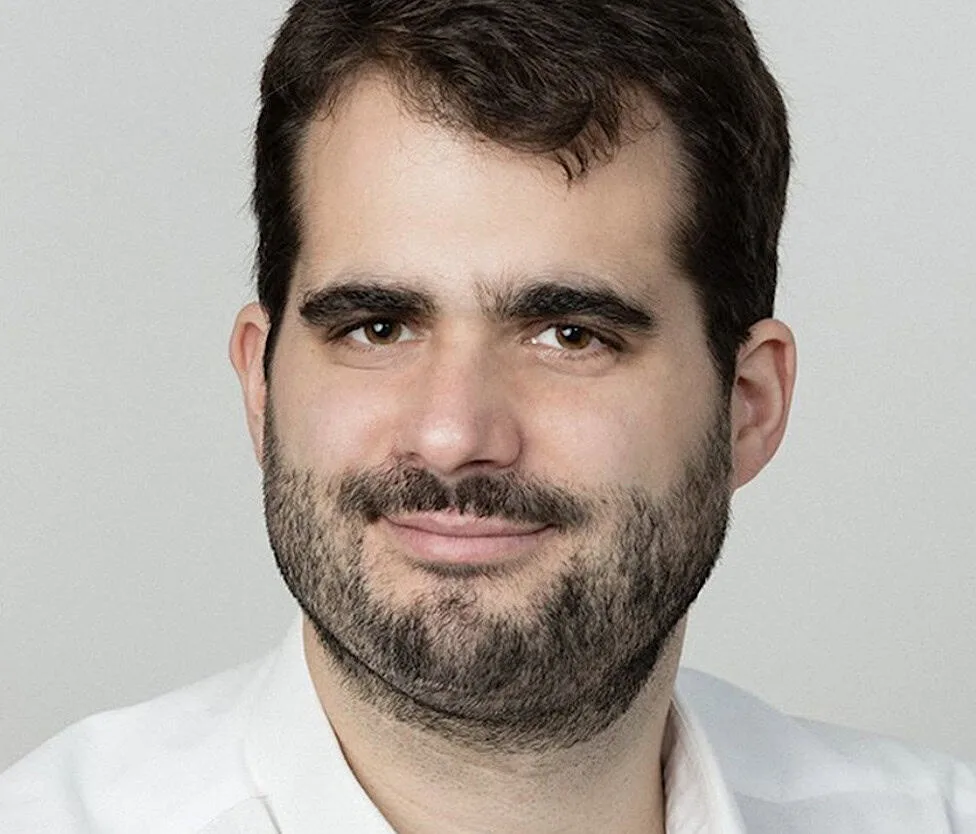 Jean-François Morizur, with dark hair and a beard, smiling slightly.